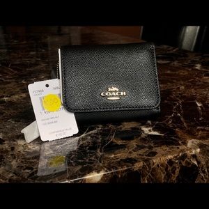 Black Coach women’s wallet.